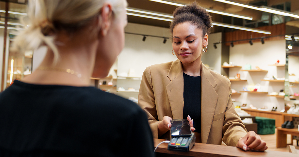 Woman using point of sale system in a retail store